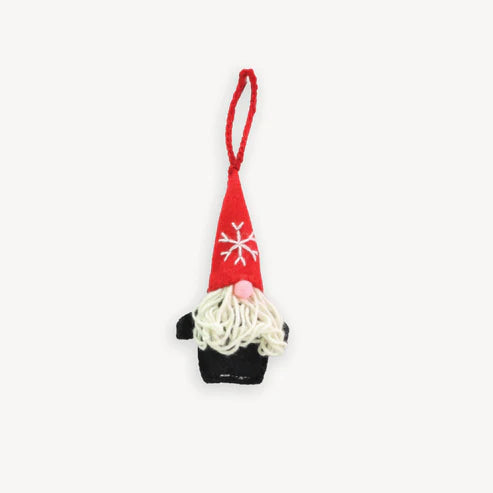 Gnome ornament with red hat and white snowflake design on a white background